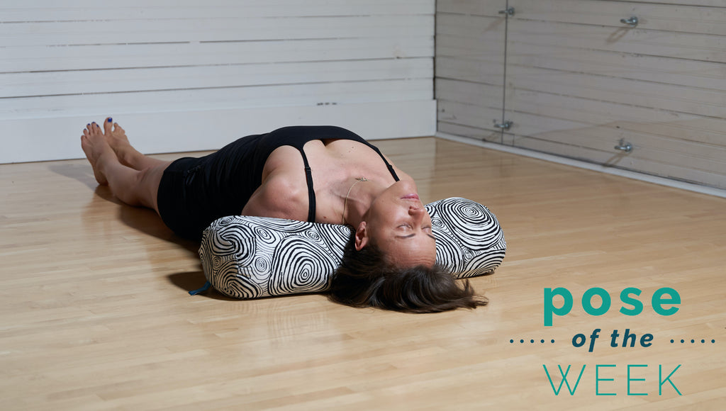 Fish pose with an atlas yoga bolster