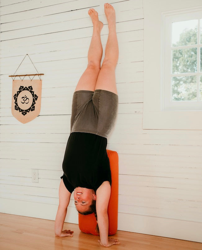 Reading Handstand Benefits and Bliss with a Bolster | Inner Space Yoga & Meditation Supplies